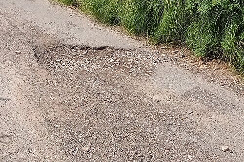 photo of a large pothole