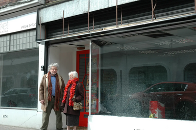 Chris Bramall & June Collins next to disused shop in Stourbridge