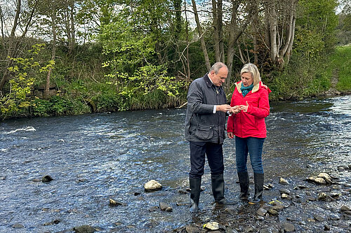 Liberal Democrat leader Ed Davey, inspecting water quality in the River Goyt with Lisa Smart MP