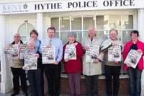 Hythe Lib Dems holding up posters calling for more police now